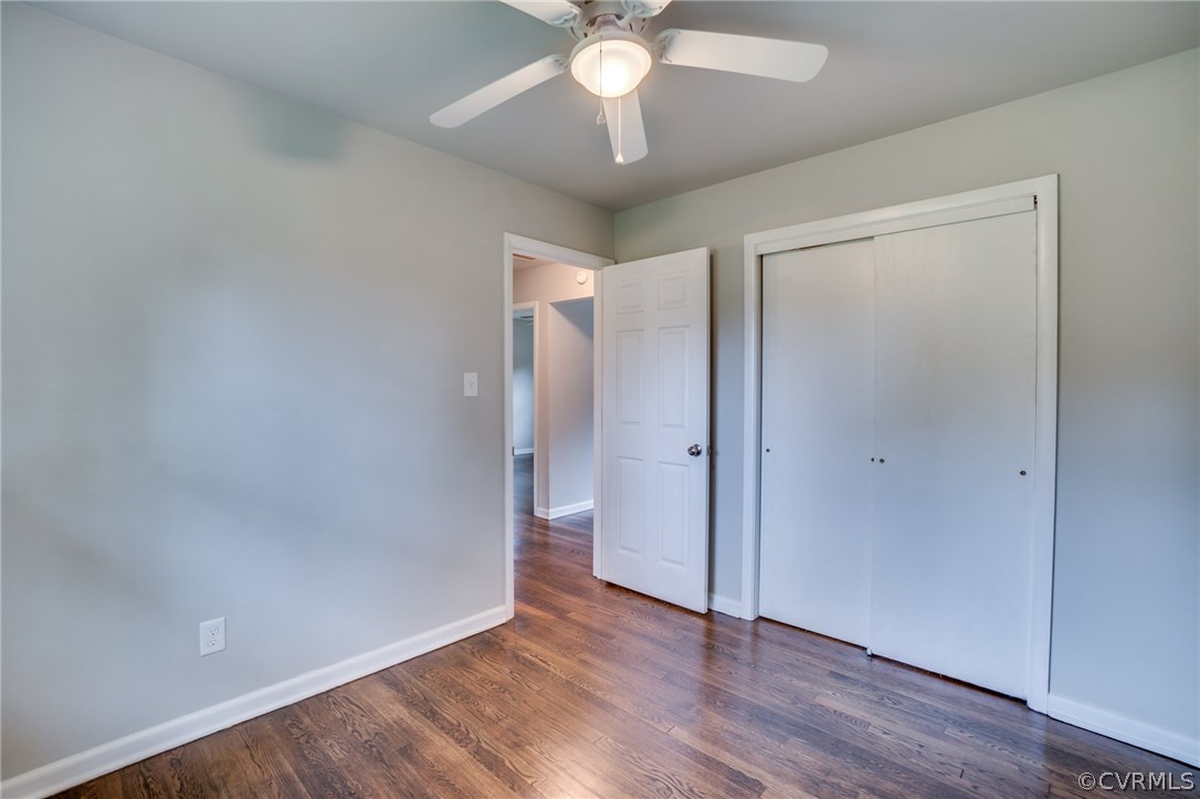 5525 Jahnke Road Richmond, VA 23225 - Photo 24 of 35 an empty room with wooden floor and a ceiling fan