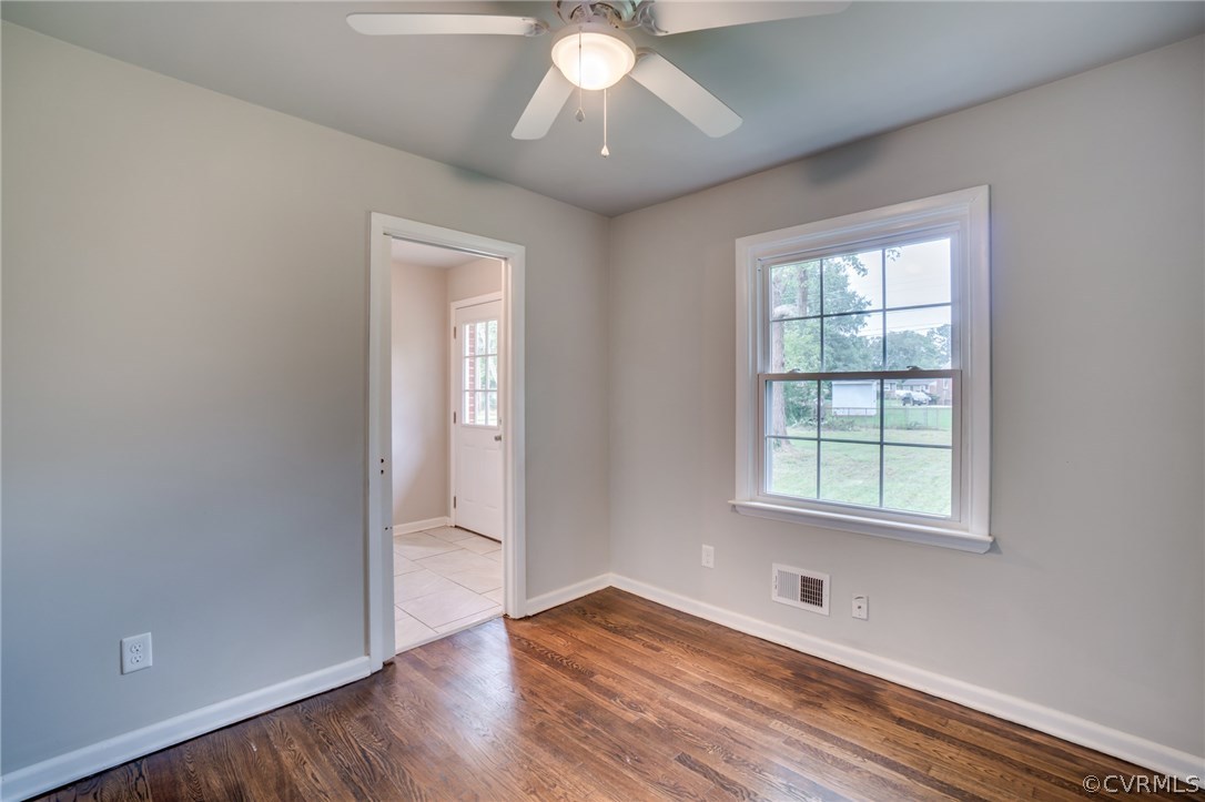 5525 Jahnke Road Richmond, VA 23225 - Photo 26 of 35 an empty room with wooden floor and windows