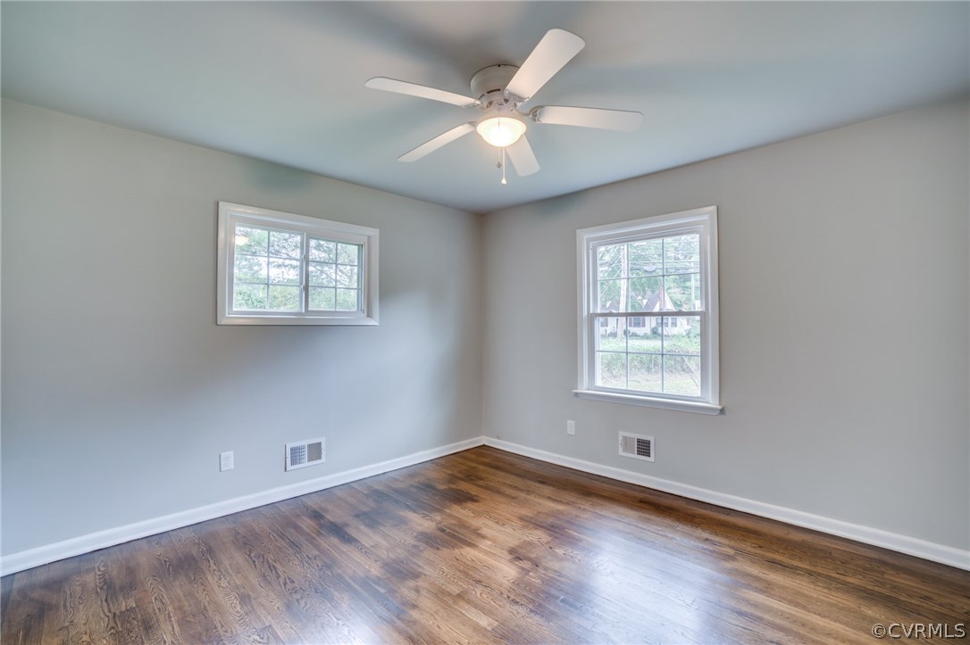 5525 Jahnke Road Richmond, VA 23225 - Photo 27 of 35 an empty room with wooden floor and windows