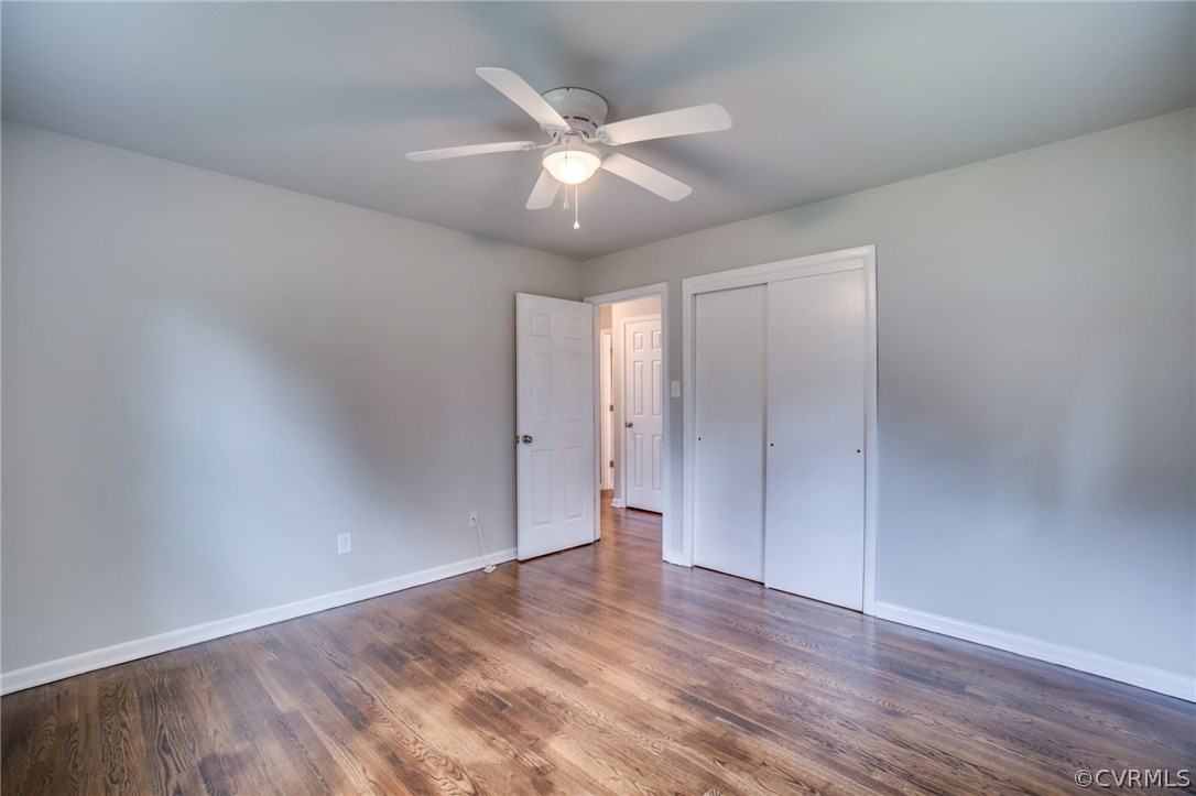 5525 Jahnke Road Richmond, VA 23225 - Photo 29 of 35 an empty room with wooden floor and ceiling fan