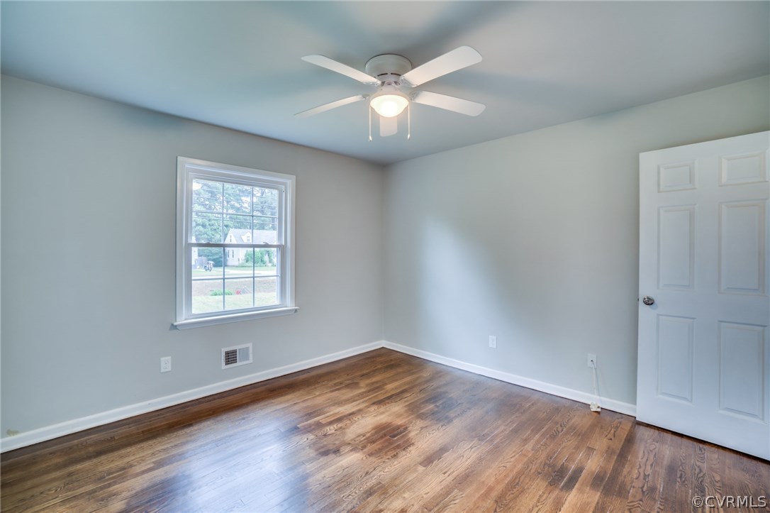 5525 Jahnke Road Richmond, VA 23225 - Photo 30 of 35 an empty room with wooden floor and windows