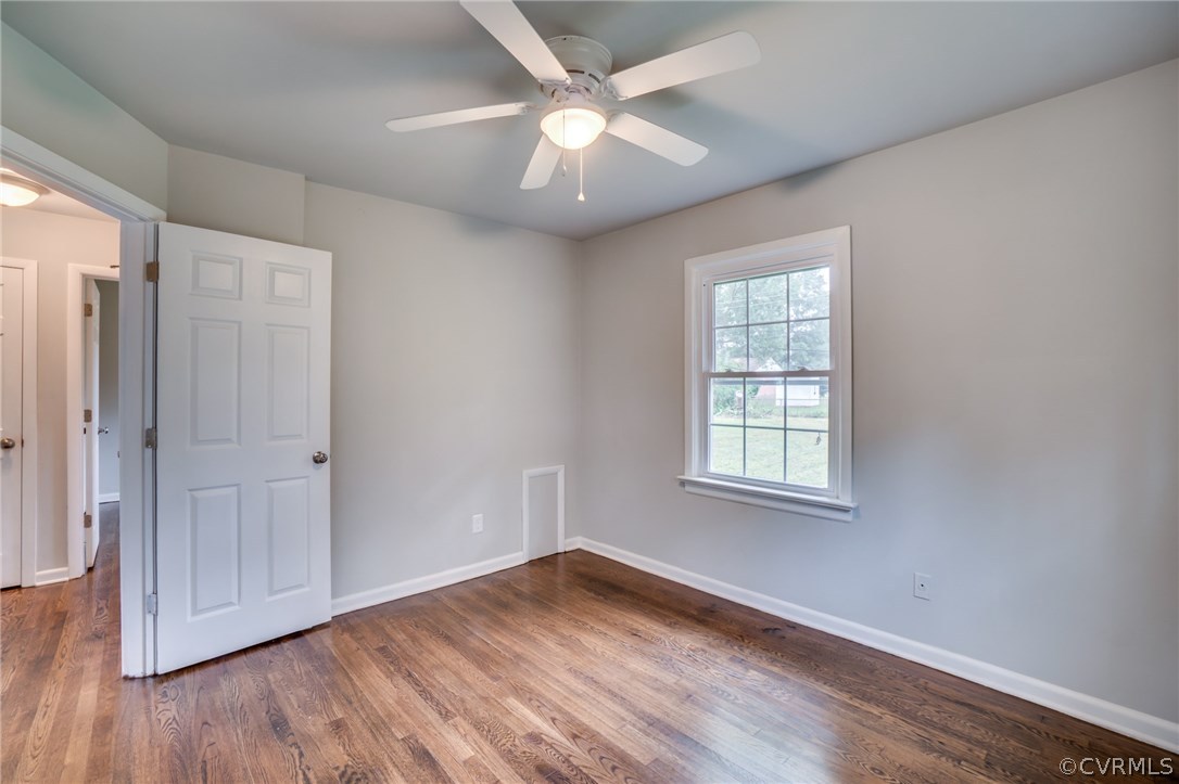 5525 Jahnke Road Richmond, VA 23225 - Photo 32 of 35 a view of an empty room with wooden floor and a window