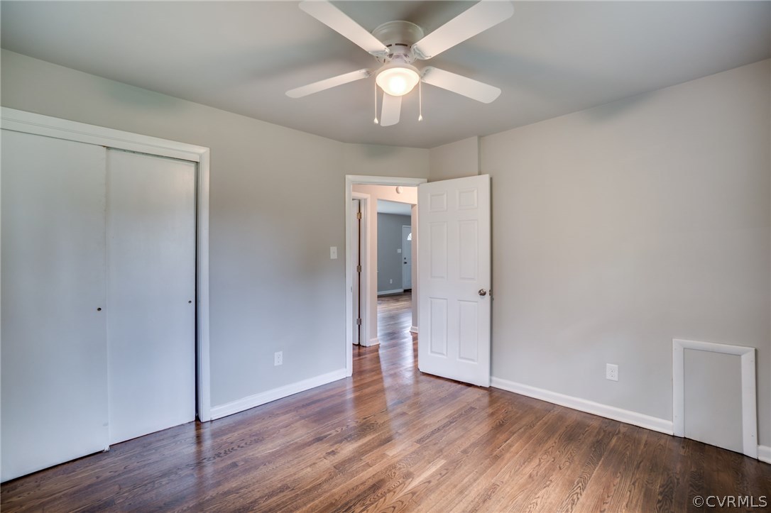 5525 Jahnke Road Richmond, VA 23225 - Photo 33 of 35 an empty room with wooden floor and a ceiling fan
