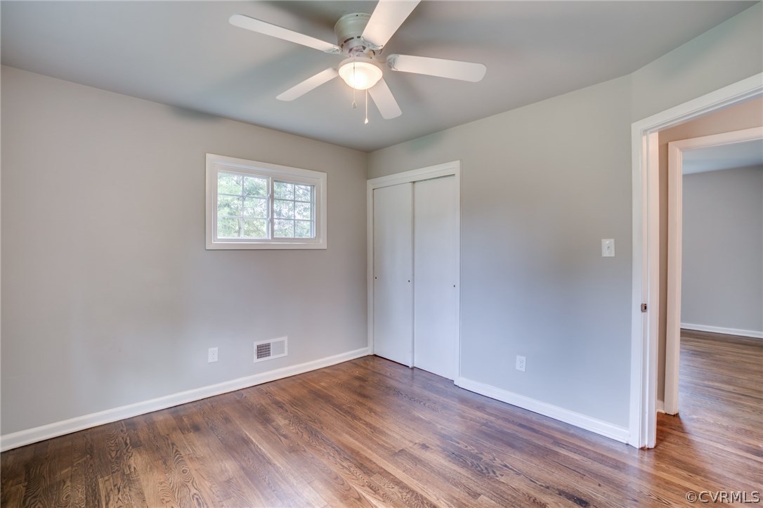 5525 Jahnke Road Richmond, VA 23225 - Photo 34 of 35 an empty room with wooden floor and windows