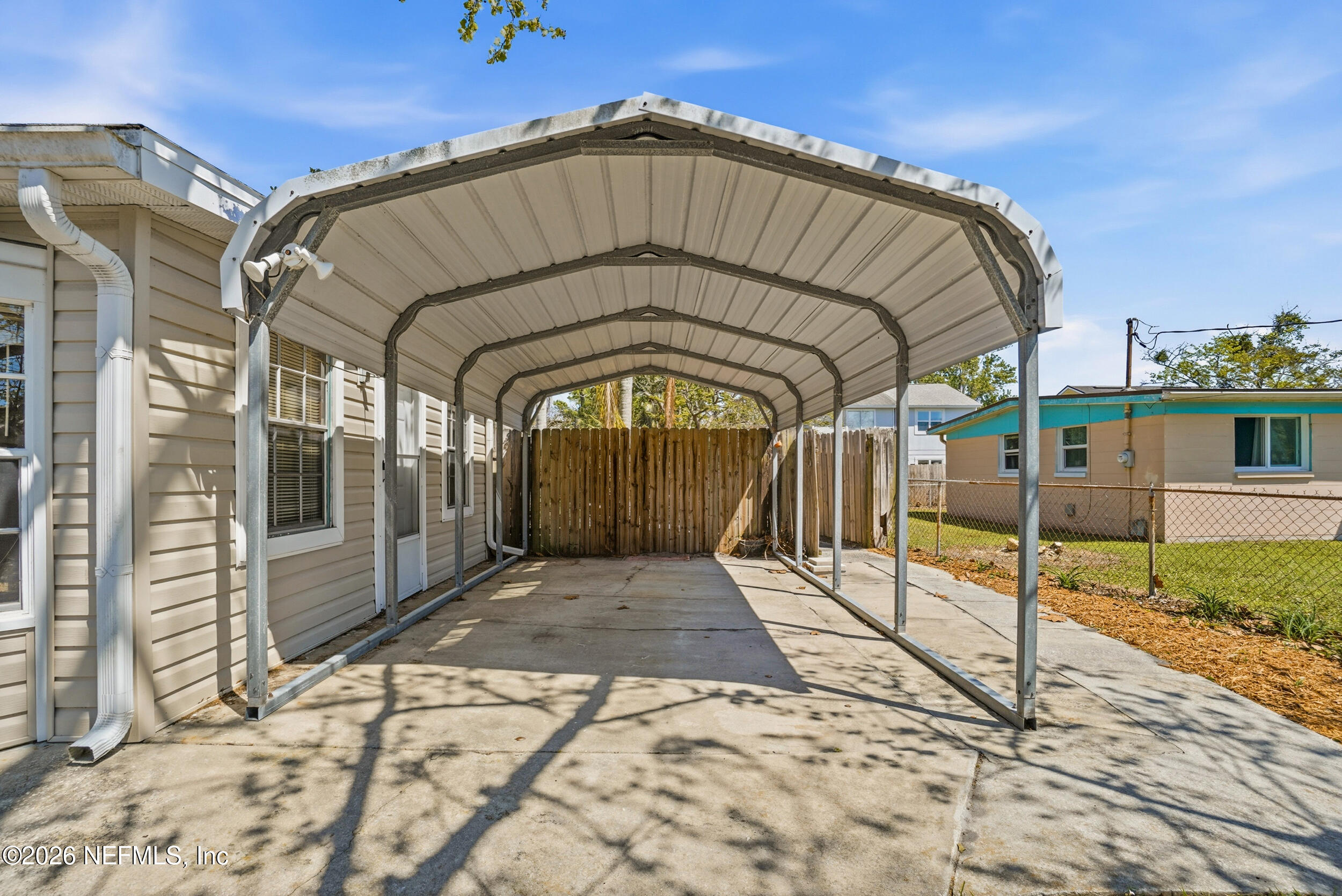 43 Forrestal Circle North Atlantic Beach, FL 32233 - Photo 29 of 39 a view of entrance gate of a house