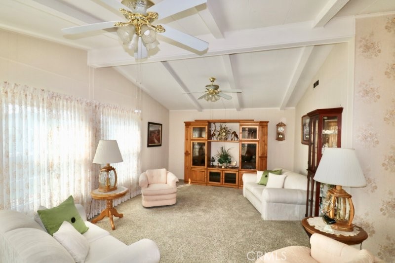 1346 Clear Lake Place, Unit 70 Brea, CA 92821 - Photo 22 of 53 a living room with furniture and a chandelier