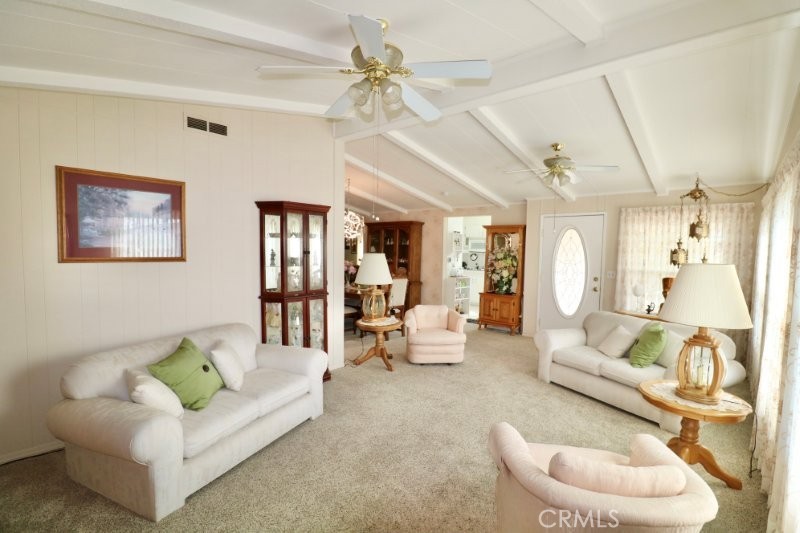 1346 Clear Lake Place, Unit 70 Brea, CA 92821 - Photo 24 of 53 a living room with furniture and a chandelier
