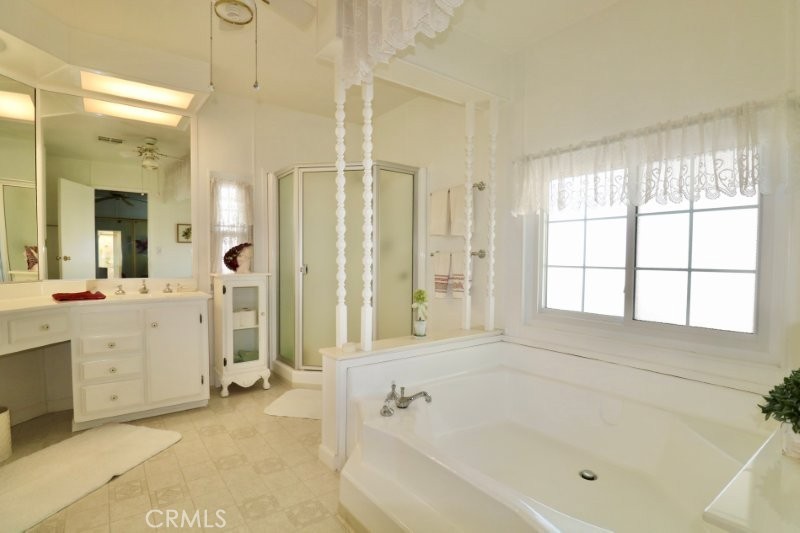 1346 Clear Lake Place, Unit 70 Brea, CA 92821 - Photo 45 of 53 a bathroom with a bathtub and a shower