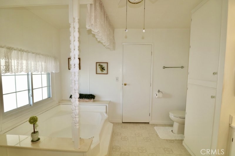 1346 Clear Lake Place, Unit 70 Brea, CA 92821 - Photo 46 of 53 a spacious bathroom with a granite countertop sink a toilet and shower