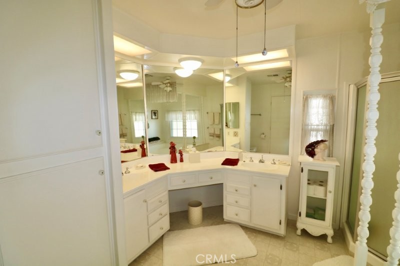1346 Clear Lake Place, Unit 70 Brea, CA 92821 - Photo 47 of 53 a bathroom with a double vanity sink mirror and a bathtub