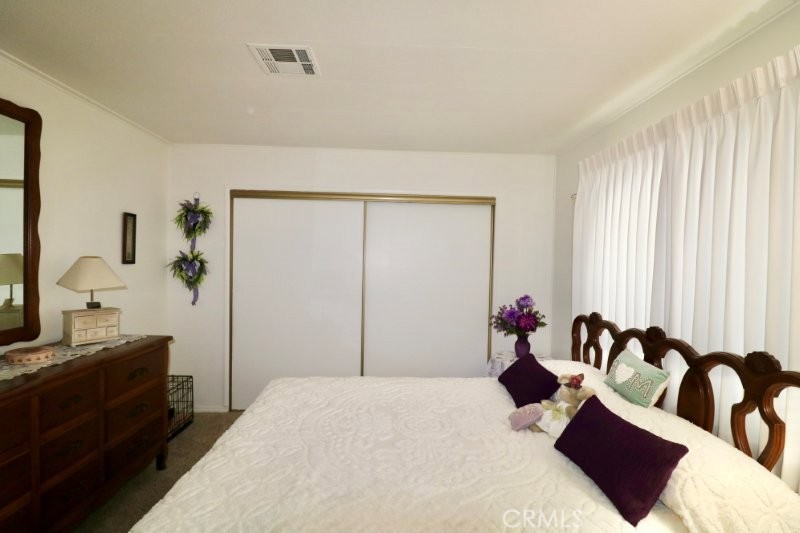 1346 Clear Lake Place, Unit 70 Brea, CA 92821 - Photo 49 of 53 a bedroom with a bed and a dresser
