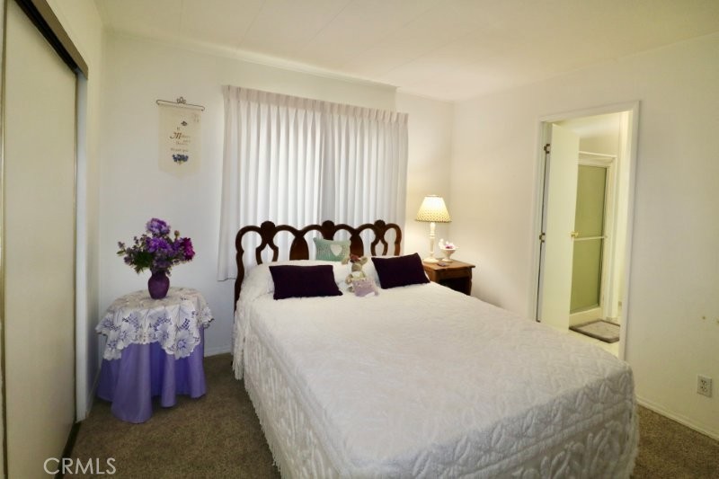 1346 Clear Lake Place, Unit 70 Brea, CA 92821 - Photo 50 of 53 a bedroom with a bed and a potted plant