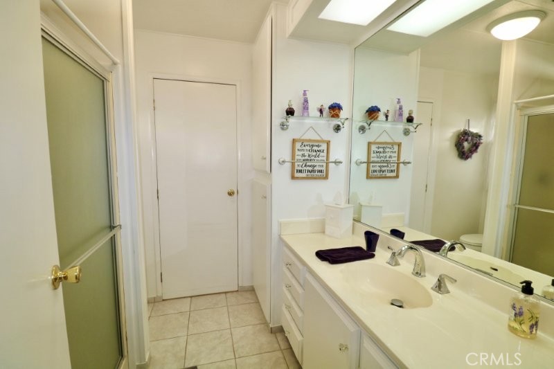 1346 Clear Lake Place, Unit 70 Brea, CA 92821 - Photo 51 of 53 a bathroom with a sink and a mirror