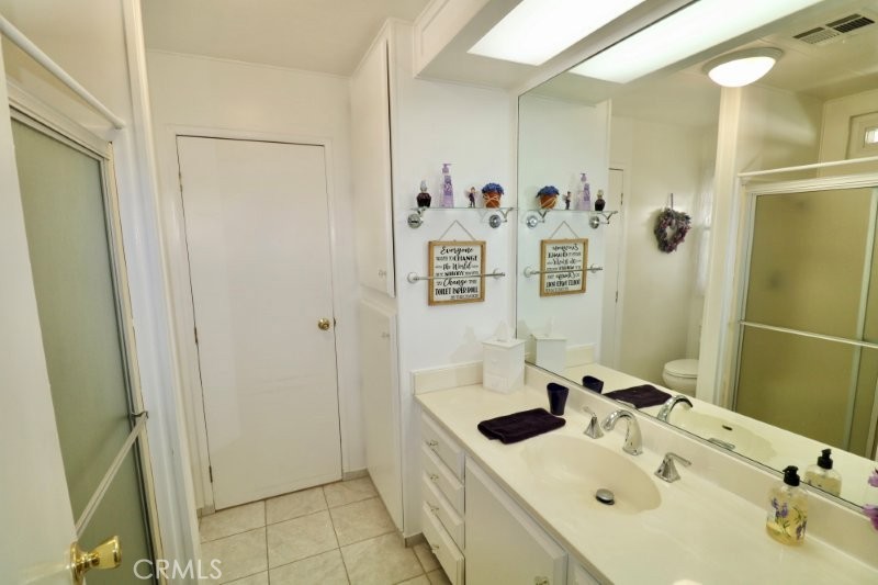 1346 Clear Lake Place, Unit 70 Brea, CA 92821 - Photo 53 of 53 a bathroom with a sink and mirror