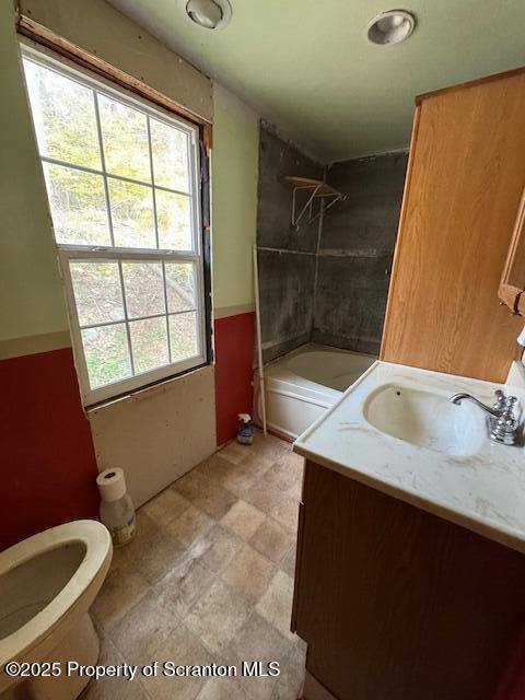 12078 Creek Road Clarks Summit, PA 18411 - Photo 17 of 20 a bathroom with a sink toilet and window