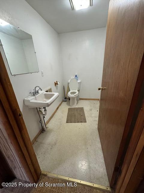 12078 Creek Road Clarks Summit, PA 18411 - Photo 10 of 20 a bathroom with a sink a toilet and a mirror