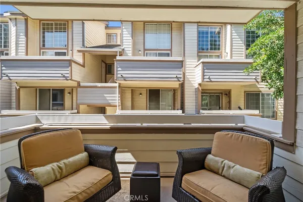 a building outdoor space with patio furniture