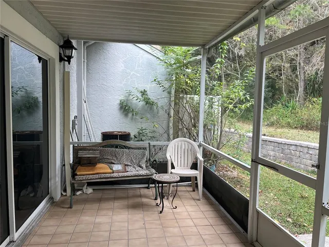 a roof deck with table and chairs