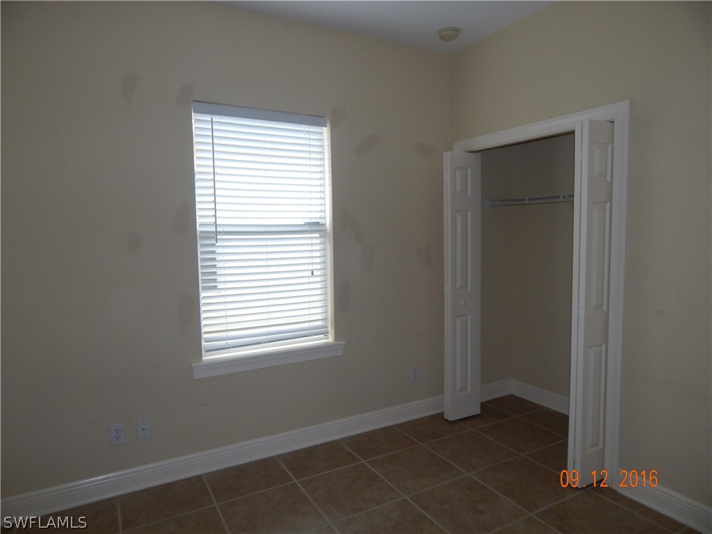 12780 River Road Fort Myers, FL 33905 - Photo 17 of 24 a view of an empty room with closet and a window