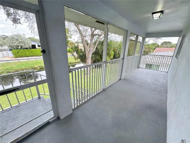 a view of a backyard with sitting area