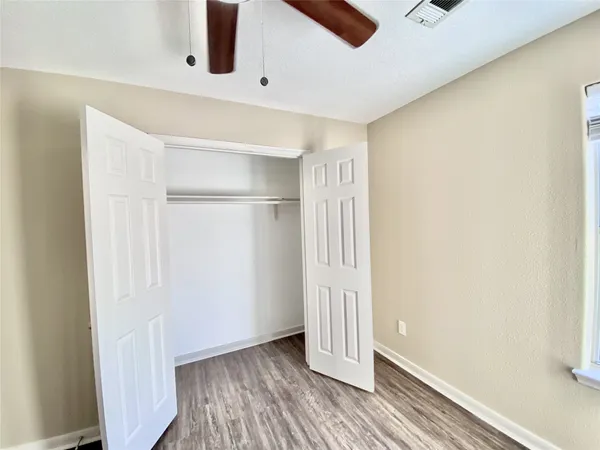 a view of front door and wooden floor