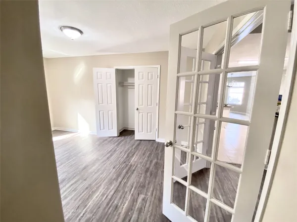 a view of walk in closet with empty racks