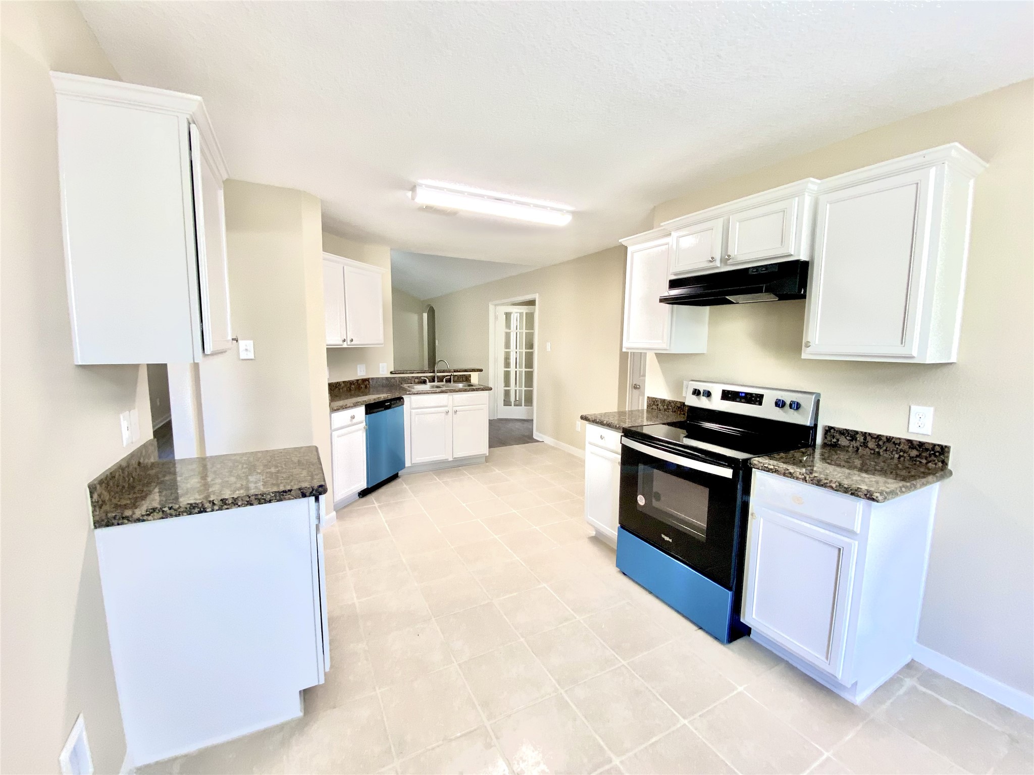 28922 San Bernard River Loop Spring, TX 77386 - Photo 21 of 31 a kitchen with granite countertop a stove and a sink
