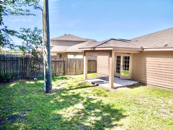 a house that has yard in front of it