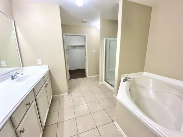 a bathroom with a bathtub sink and toilet