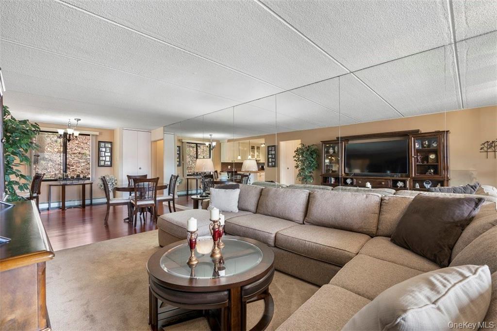 1116 Warburton Avenue, Unit 2A Yonkers, NY 10701 - Photo 5 of 19 a living room with furniture kitchen view and a large window