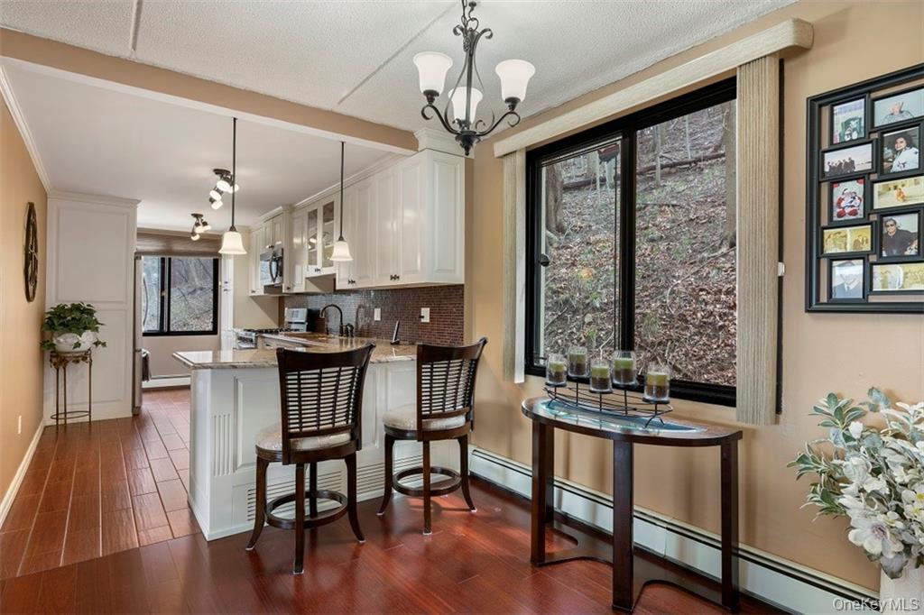 1116 Warburton Avenue, Unit 2A Yonkers, NY 10701 - Photo 6 of 19 a view of a dining room with furniture window and wooden floor
