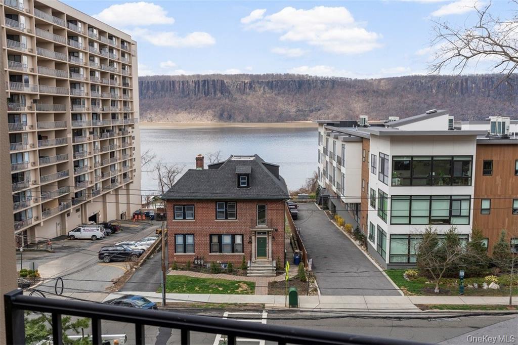 1116 Warburton Avenue, Unit 2A Yonkers, NY 10701 - Photo 10 of 19 a view of a brick building next to a yard