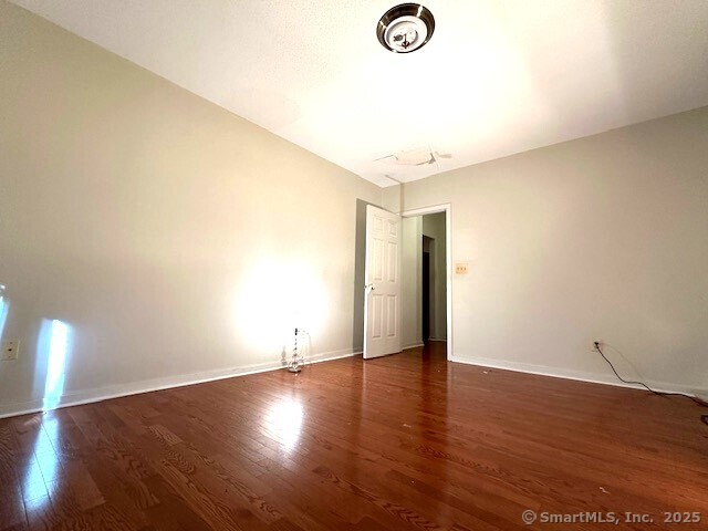 500 Prospect Street, Unit 1E New Haven, CT 06511 - Photo 10 of 18 a view of an empty room with wooden floor
