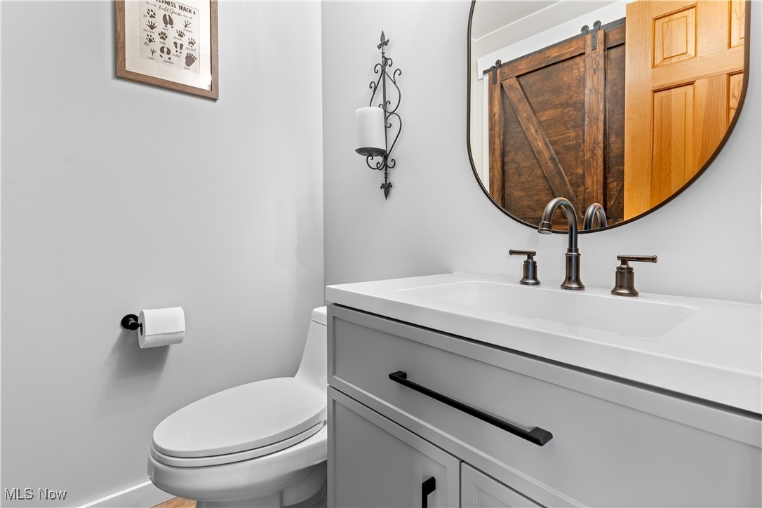 1784 North Medina Line Road Akron, OH 44333 - Photo 12 of 50 Half bath with vanity and toilet