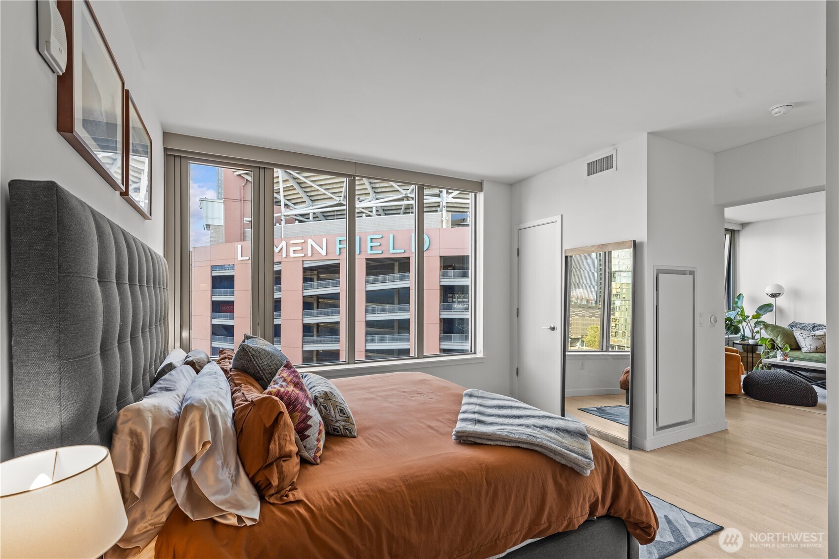 590 1st Avenue South, Unit 715 Seattle, WA 98104 - Photo 17 of 39 a bedroom with a large bed and a large window