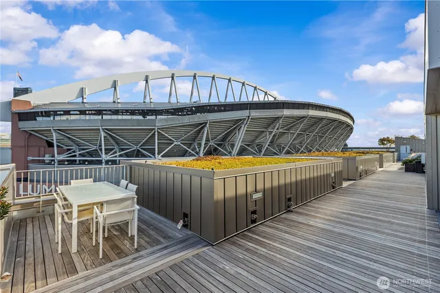 a view of a patio with couches table and chairs and potted plants