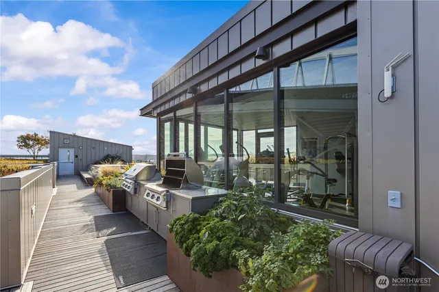 a view of a balcony with two chairs and a table