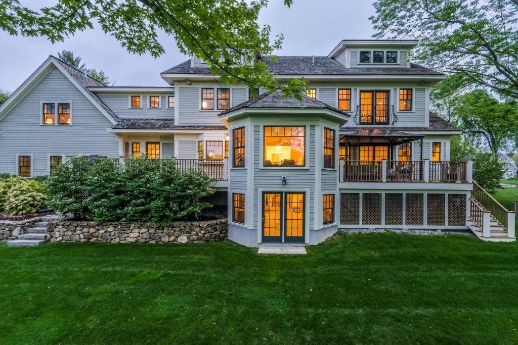 1643 Monument Street Concord, MA 01742 - Photo 1 of 27 a front view of a house with a garden