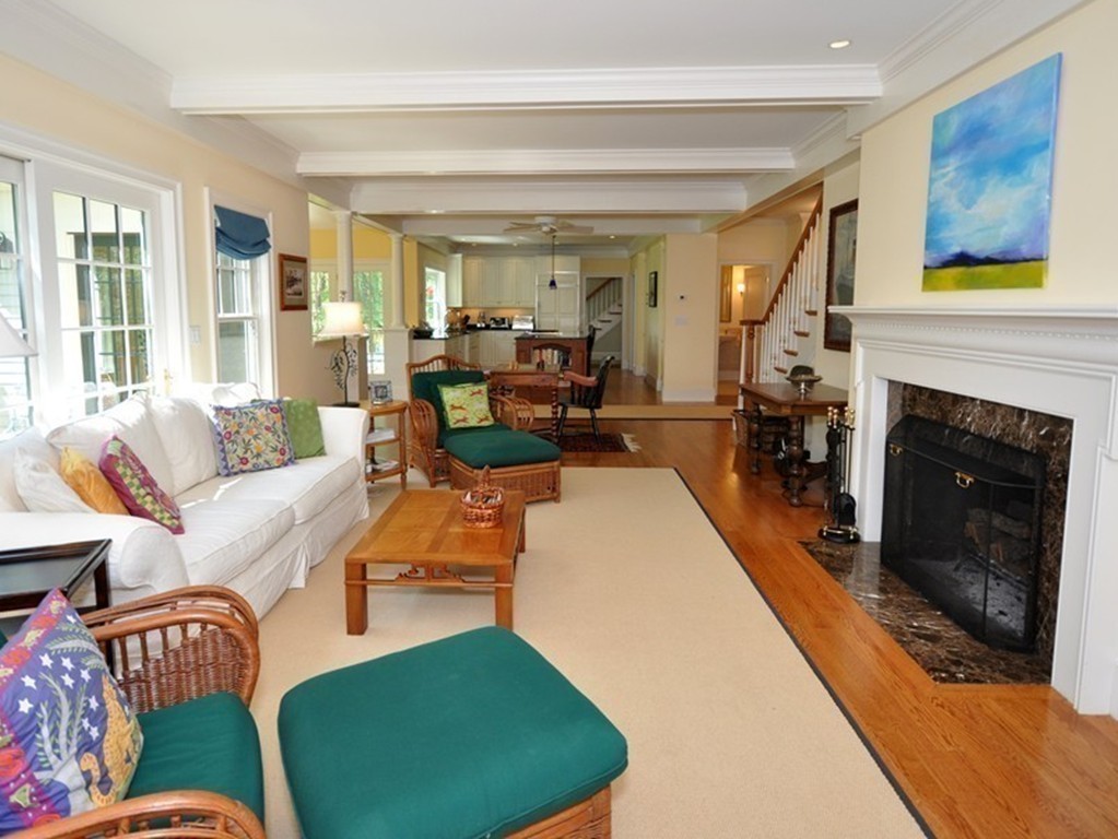 1643 Monument Street Concord, MA 01742 - Photo 11 of 27 a living room with furniture and a fireplace