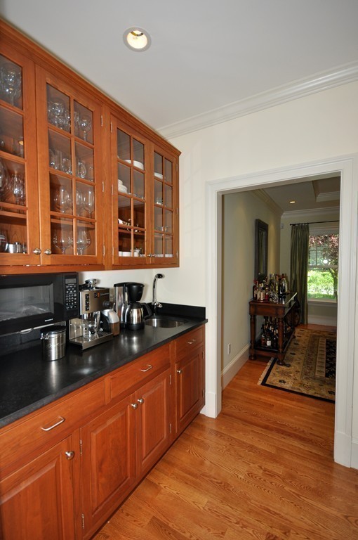 1643 Monument Street Concord, MA 01742 - Photo 13 of 27 a kitchen with granite countertop a sink and cabinets