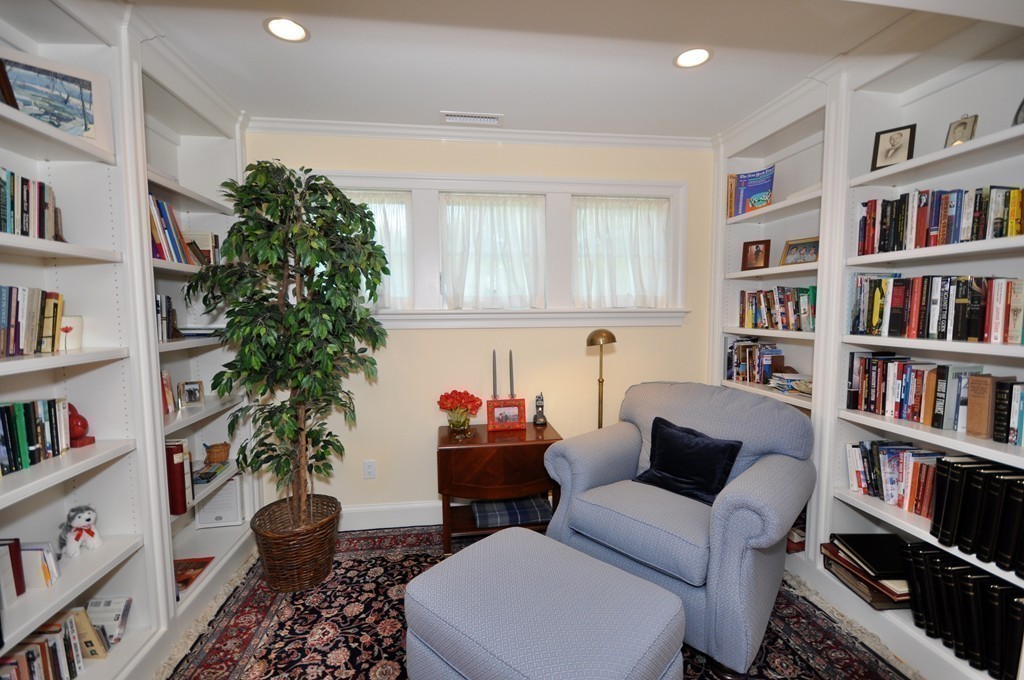 1643 Monument Street Concord, MA 01742 - Photo 16 of 27 a living room with furniture and a potted plant or book shelf