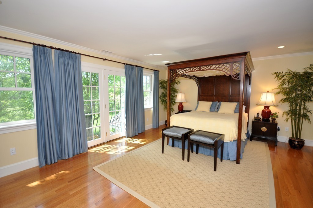 1643 Monument Street Concord, MA 01742 - Photo 17 of 27 a bedroom with furniture and a large window
