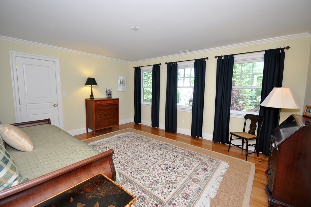 1643 Monument Street Concord, MA 01742 - Photo 19 of 27 a view of a bedroom with furniture and window