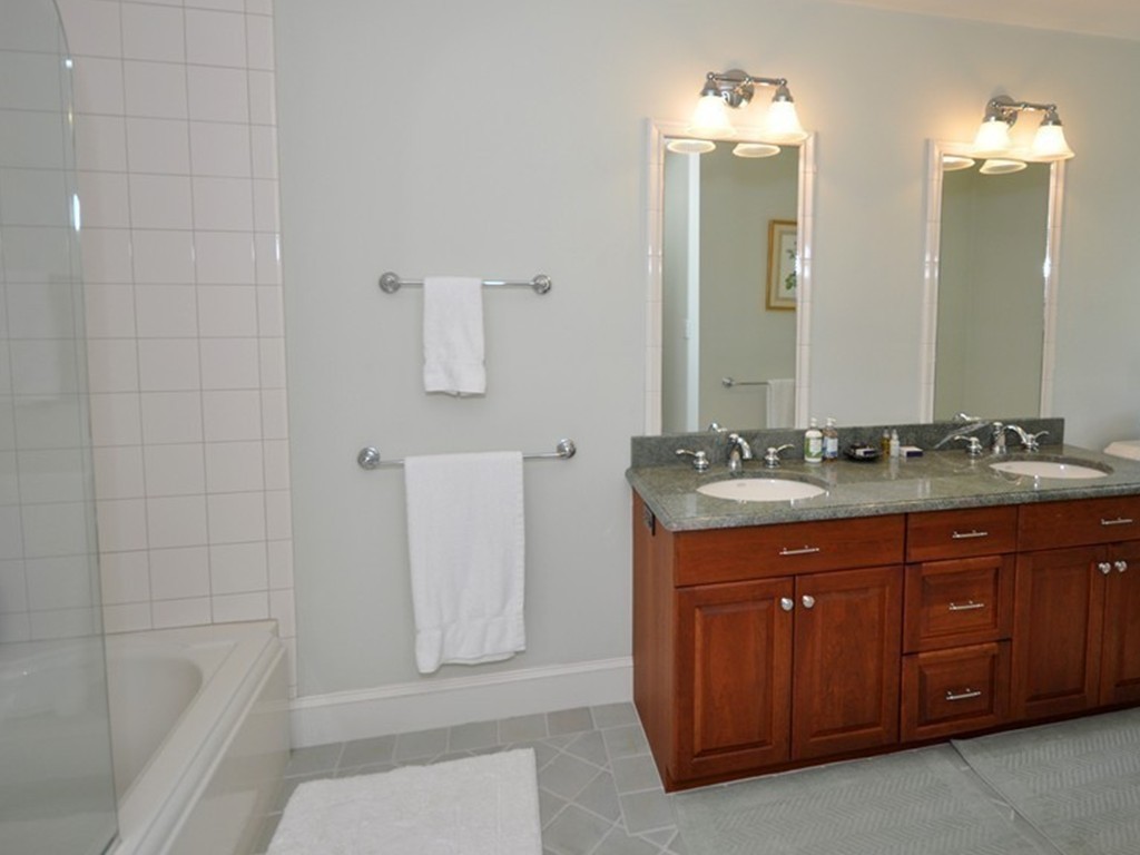 1643 Monument Street Concord, MA 01742 - Photo 20 of 27 a bathroom with a sink and a mirror
