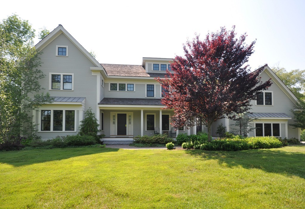 1643 Monument Street Concord, MA 01742 - Photo 2 of 27 a front view of a house with a yard