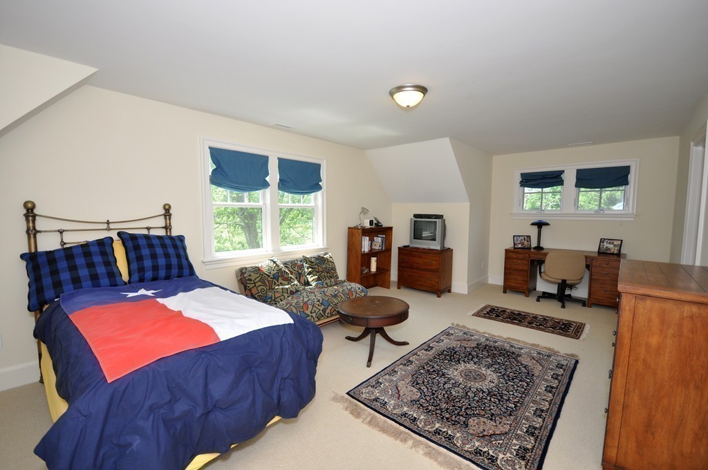 1643 Monument Street Concord, MA 01742 - Photo 22 of 27 a living room with furniture and a rug