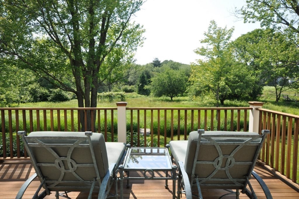1643 Monument Street Concord, MA 01742 - Photo 4 of 27 a view of a chairs and table on the deck