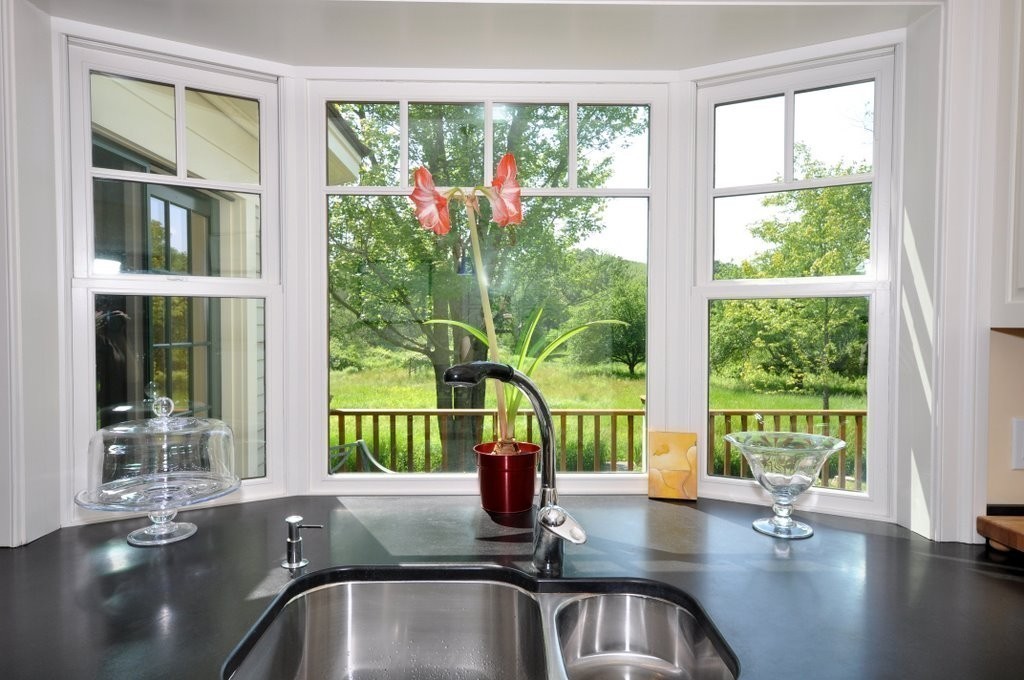 1643 Monument Street Concord, MA 01742 - Photo 8 of 27 a kitchen with a sink and large window