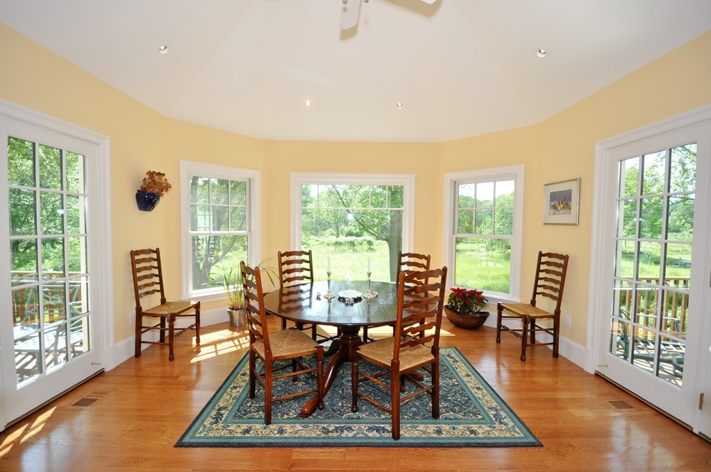 1643 Monument Street Concord, MA 01742 - Photo 9 of 27 a dining room with furniture window and wooden floor
