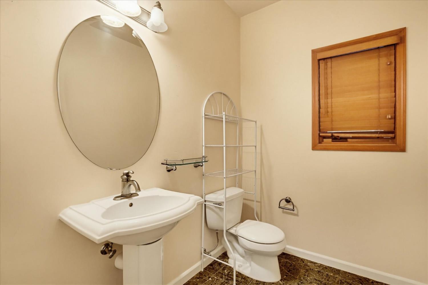 14517 North Bloomfield Road Nevada City, CA 95959 - Photo 20 of 78 a bathroom with a toilet sink and mirror